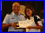 Col Chang presenting the Junior President's Pistol Match (.22) Award to Rebekah Jennings of TSRA Jrs