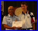 John Seward of TSRA Jrs receiving a Certificate of Achievement for his Second Place finish in the Junior Individual Pistol Match (.22)