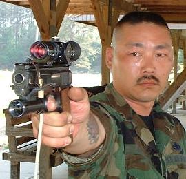 MSgt Hamada with a RIKA trainer affixed to his M1911