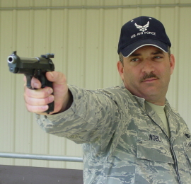 TSgt Noblit with his 1911 wadcutter pistol